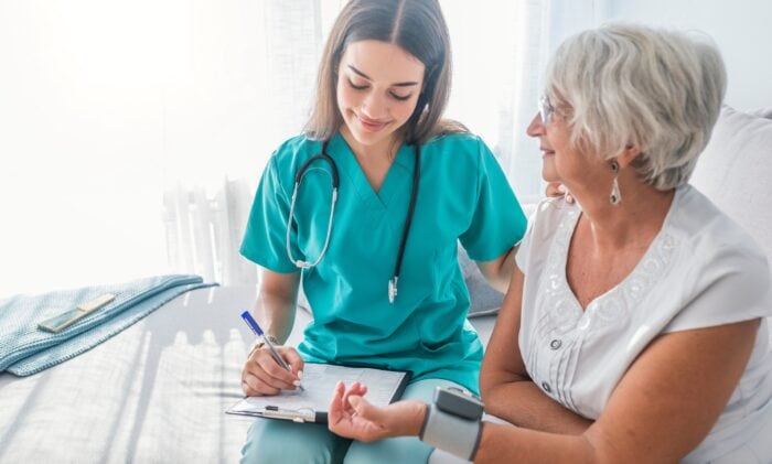 smiling APC meeting with patient